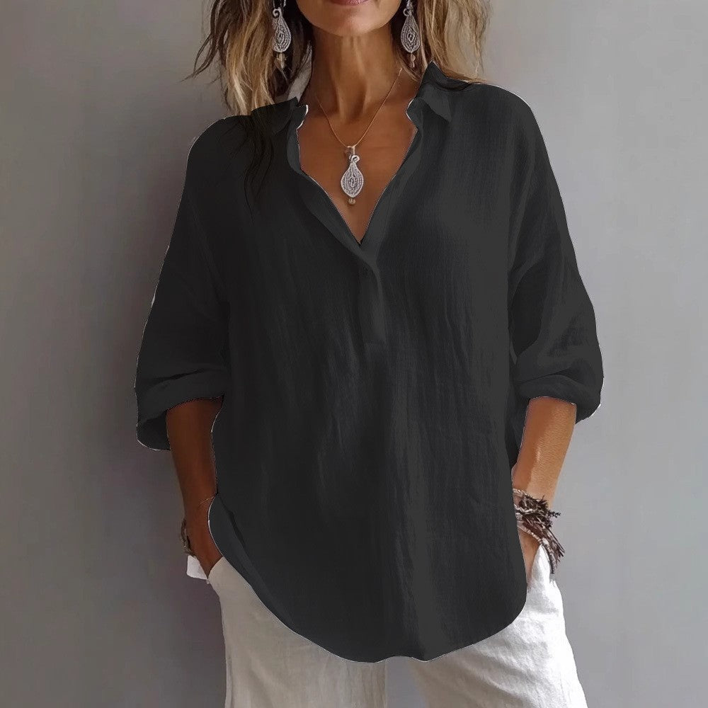Elegant women's button-up blouse, relaxed fit, wide sleeves. A comfortable and versatile top for modern women.