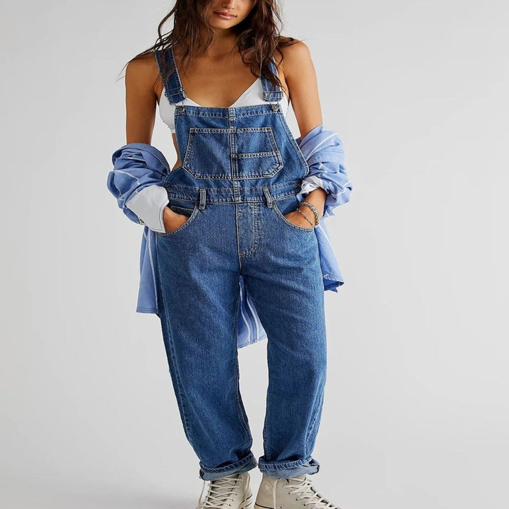Fashionable women's utility-style relaxed fit overalls, featuring a wide leg and adjustable straps for casual comfort.
