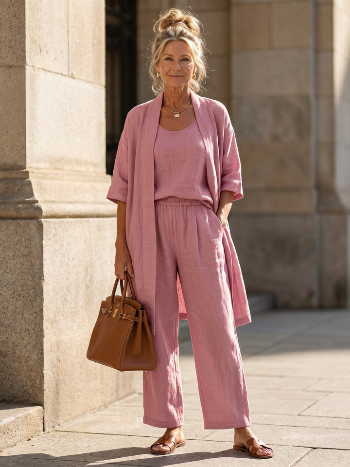 Women's relaxed three-piece top and wide-leg pant set. Comfortable loungewear.