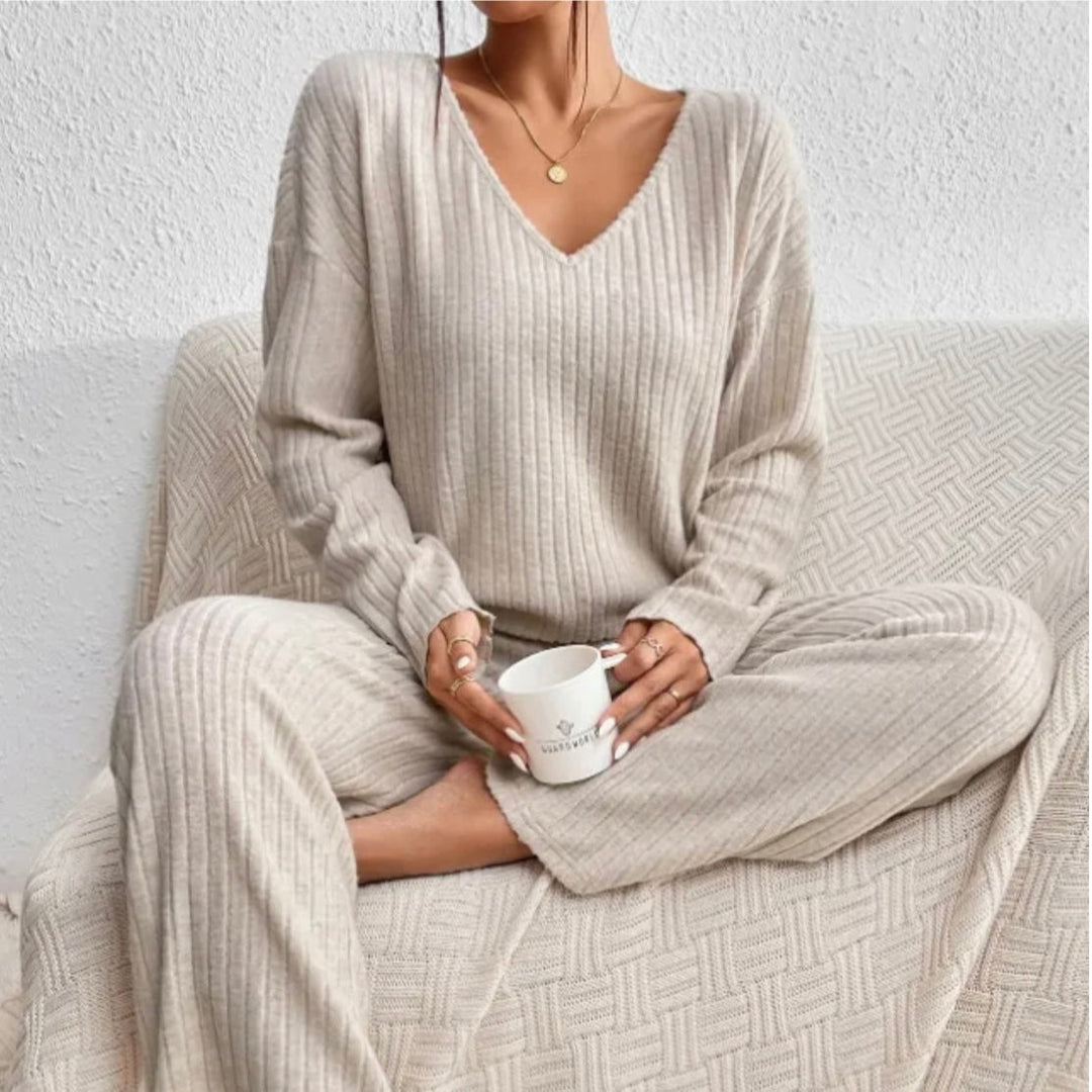 Women's ribbed knit loungewear set with V-neck top & wide-leg pants. Cozy two-piece matching set.