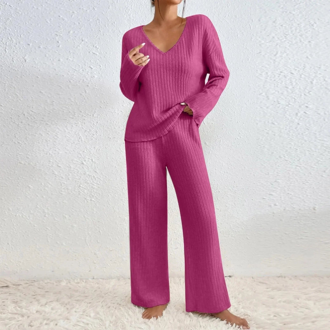 Women's knit loungewear matching set. Features a V-neck top and wide-leg ribbed pants for cozy casual wear.