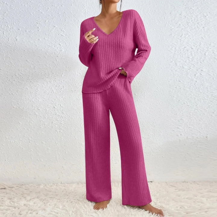 Women's knit loungewear matching set. Features a V-neck top and wide-leg ribbed pants for cozy casual wear.