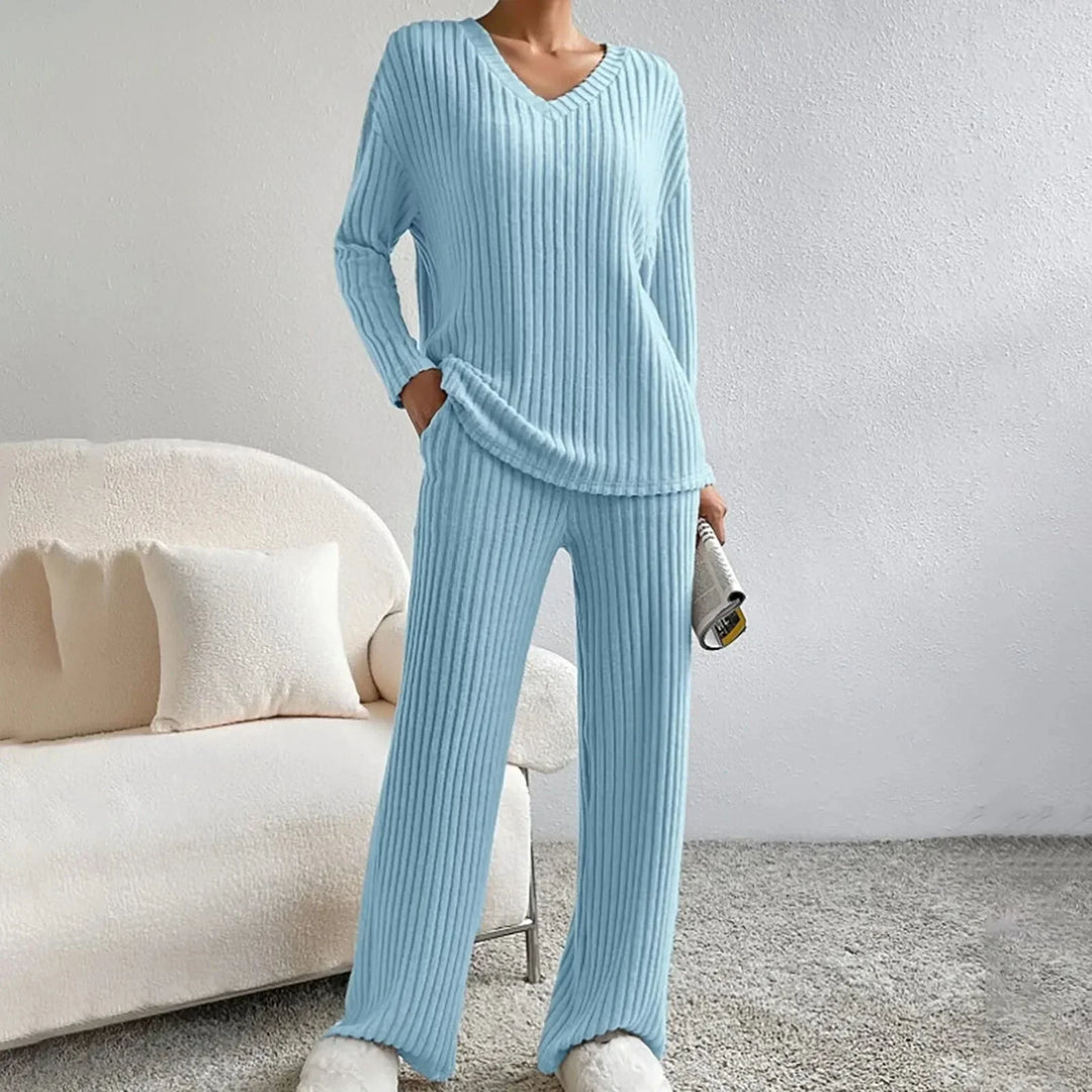 Women's V-neck knit loungewear set. Two-piece matching set with wide-leg ribbed pants for cozy casual wear.