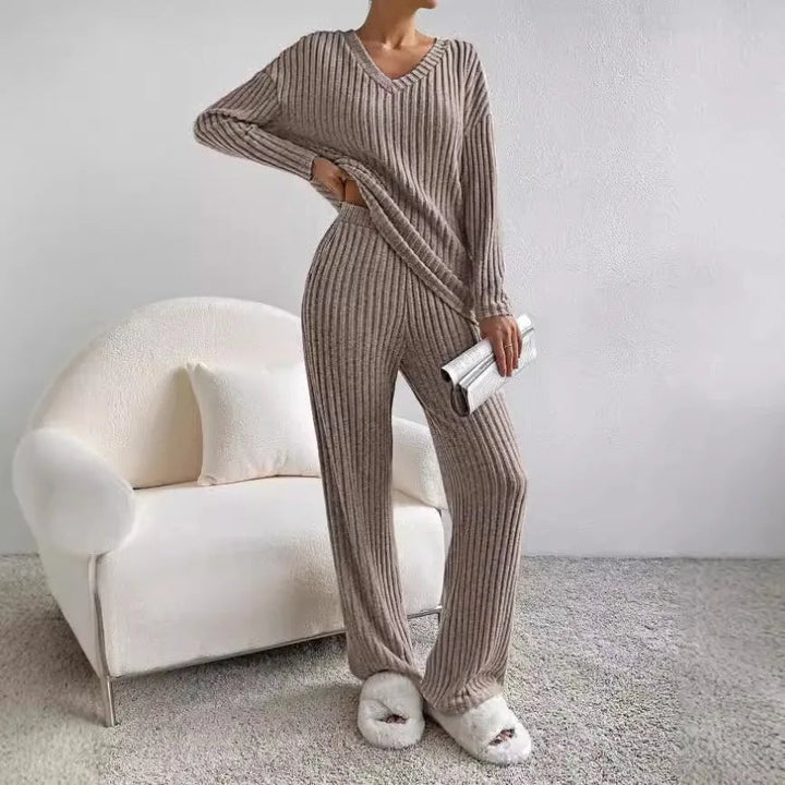 Chic women's knit loungewear. Ribbed V-neck top and wide-leg pants create a comfortable, casual matching set.