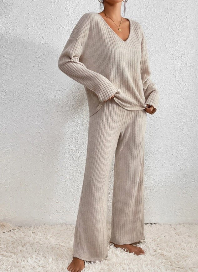 Women's casual knit loungewear set. Matching V-neck top & wide-leg ribbed pants for everyday comfort.