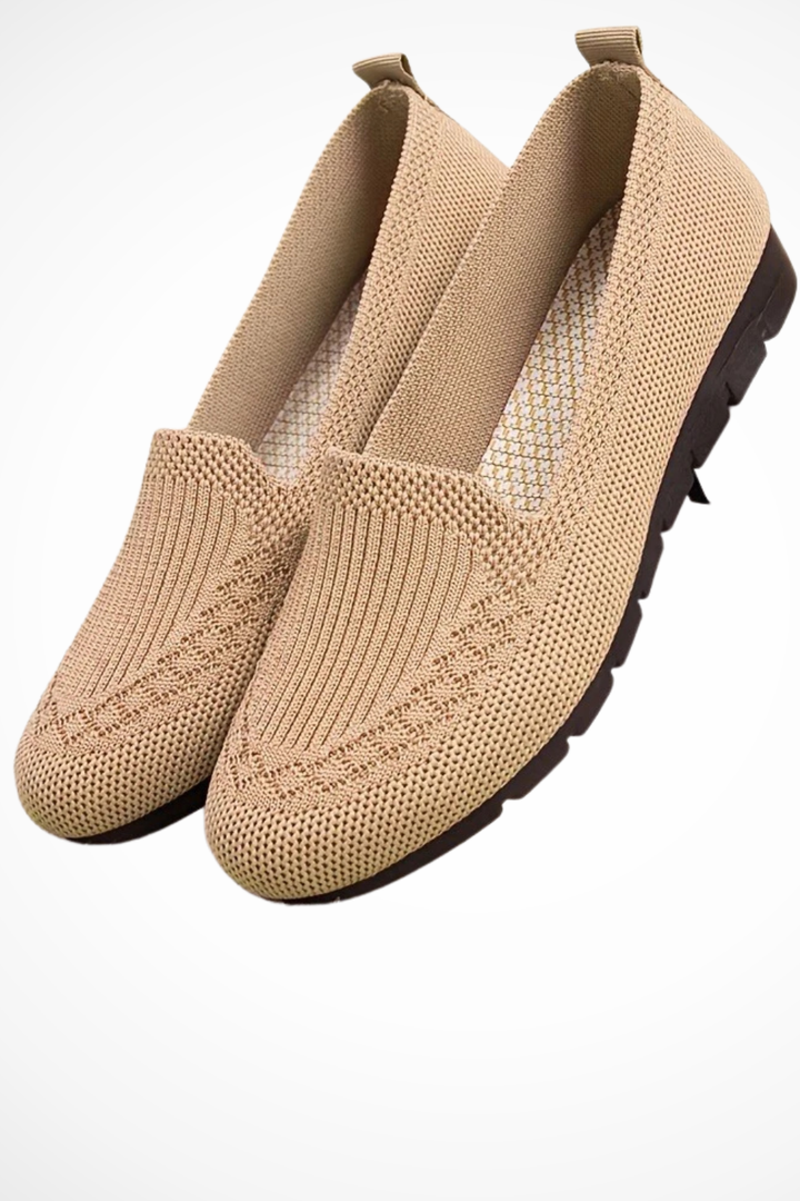 Classic women's round toe ballet flats, slip-on design for comfortable everyday style.