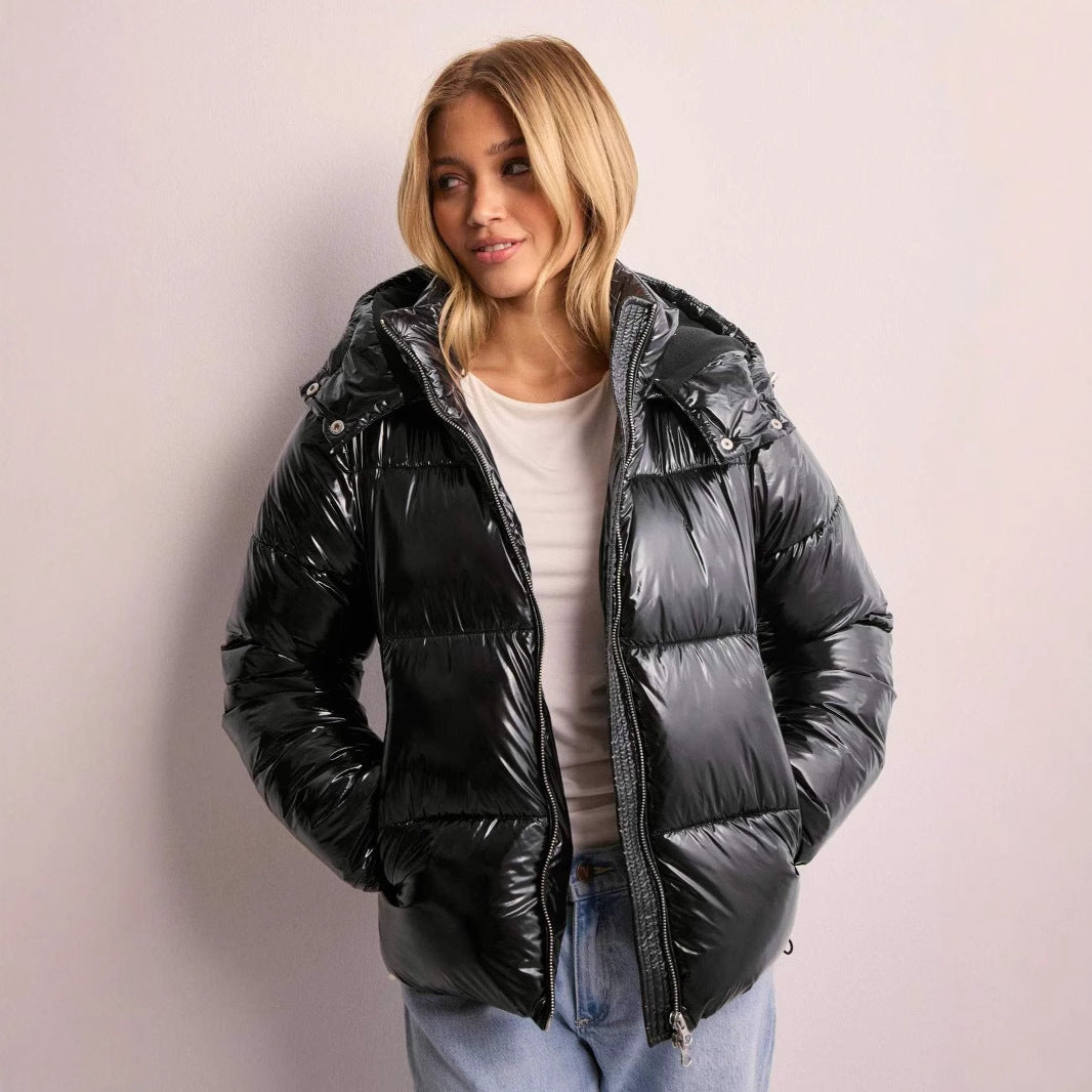 Women's shiny quilted jacket with a removable hood, ideal for fall & winter fashion outerwear.
