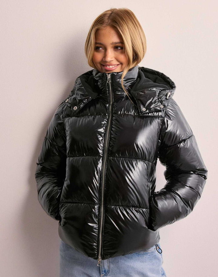 Modern women's shiny quilted jacket, a fashionable winter & fall coat with a convenient removable hood.