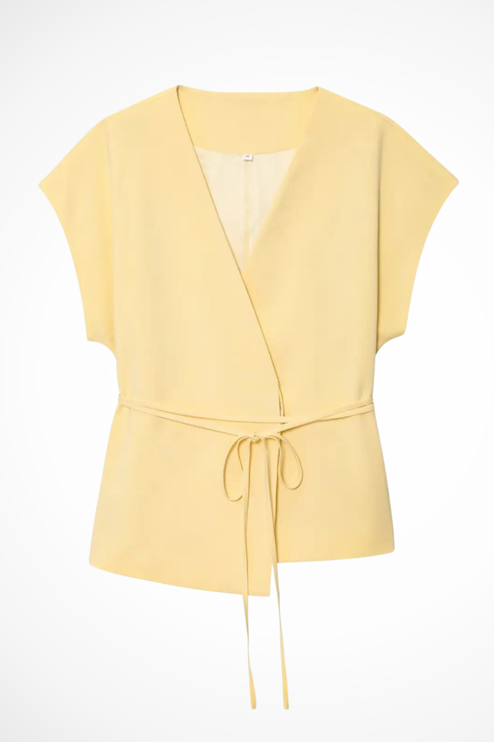 Versatile women's sleeveless suit. Belted wrap top and wide leg trousers, ideal for office or casual wear.