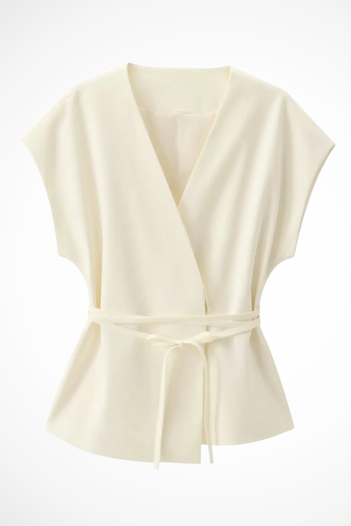 Women's coordinated two-piece outfit: sleeveless wrap top, adjustable belt, & fashionable wide leg trousers.