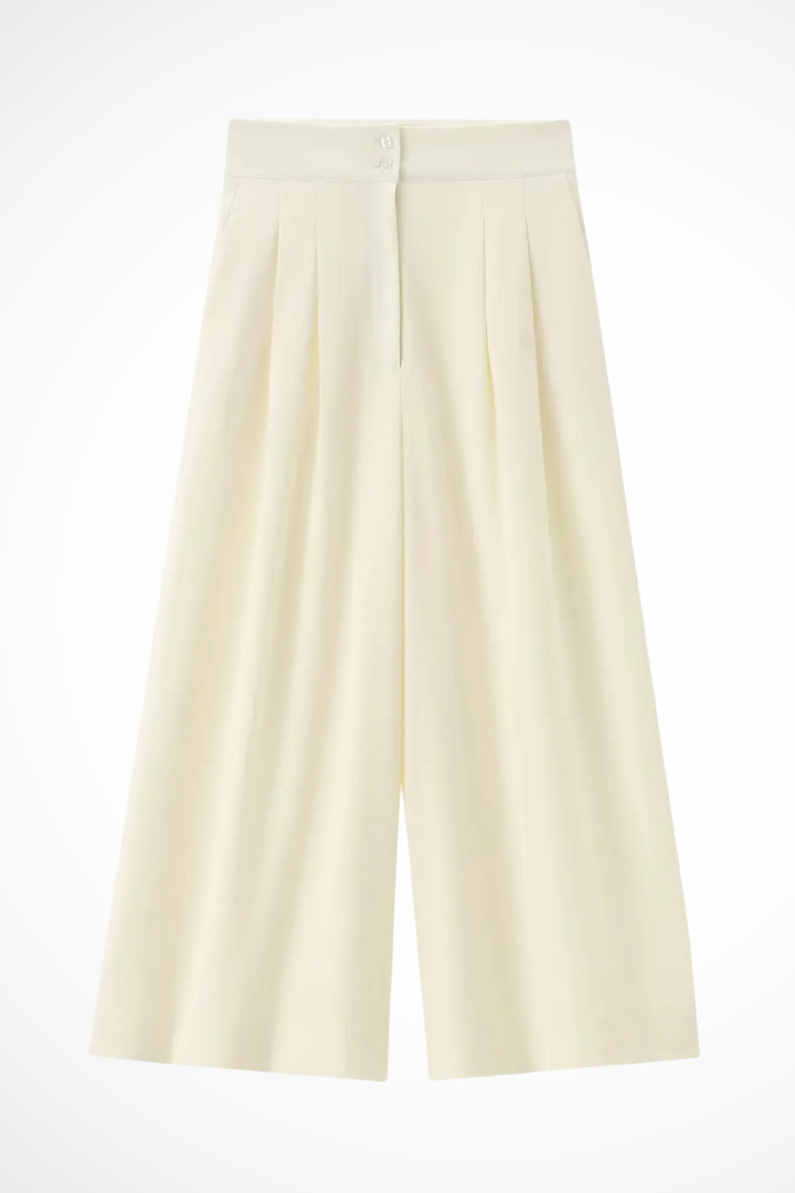 Chic women's sleeveless suit set featuring a flattering wrap top and comfortable wide leg pants.