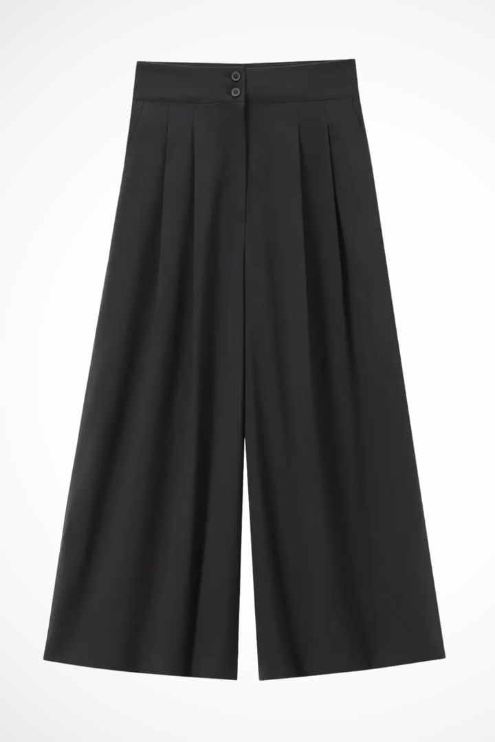 Coordinated women's clothing set: sleeveless wrap top, self-tie belt, & comfortable wide leg trousers.
