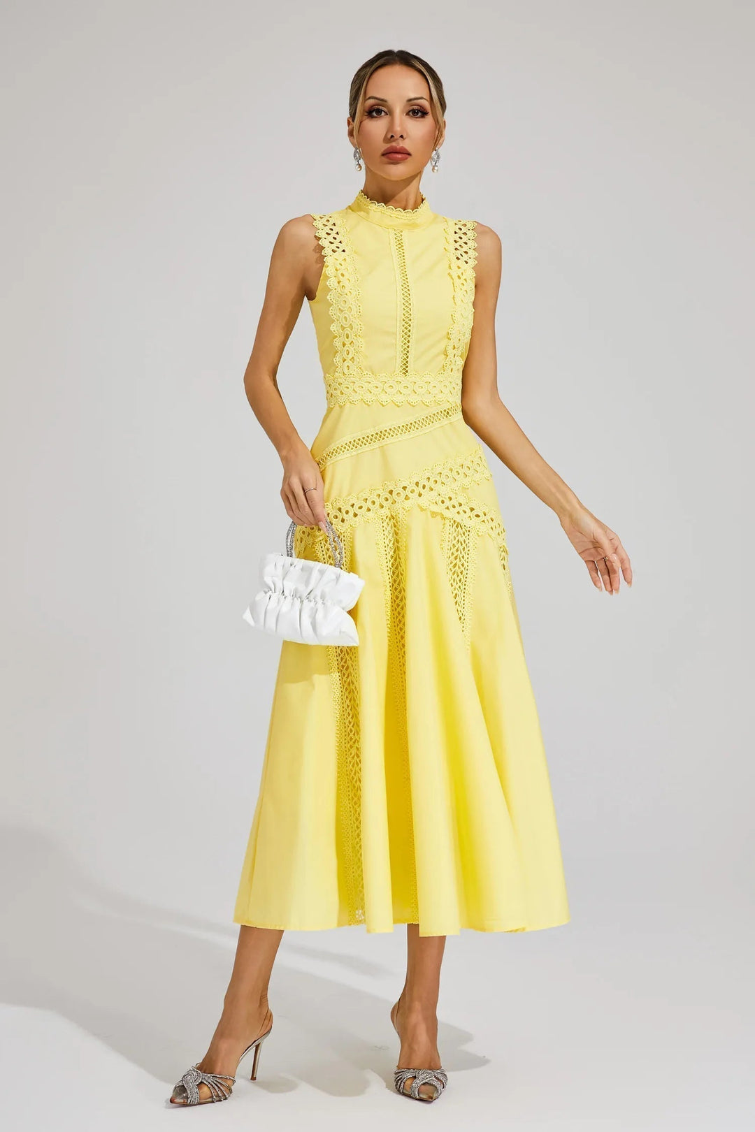 Fashionable women's midi dress, sleeveless, designed for wedding guests. An elegant choice for summer parties.
