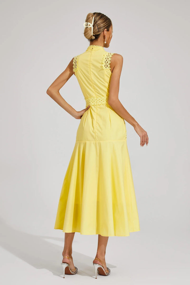 Women's sleeveless midi wedding guest dress, offering a sophisticated & comfortable fit for any special occasion.