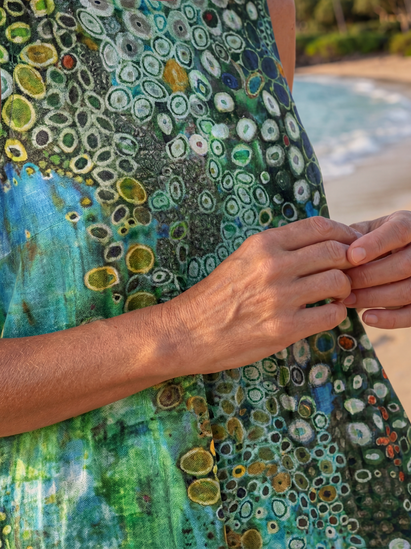 Women's sleeveless midi dress featuring a vibrant Ocean Mosaic print, an effortless choice for summer comfort.