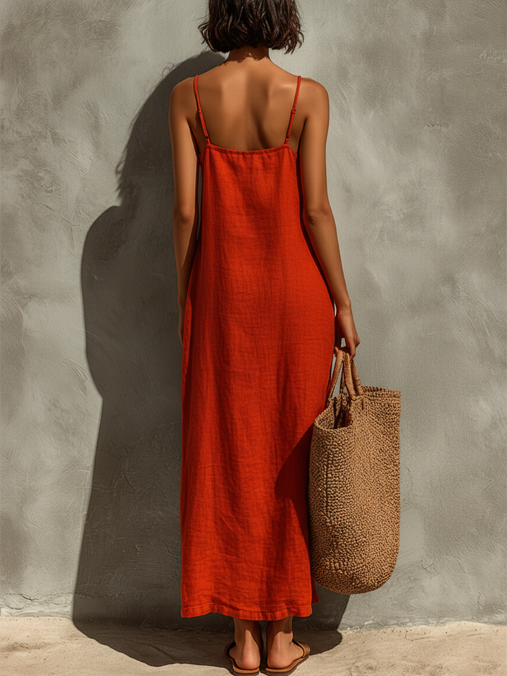 Woman walking in a stylish sleeveless square neck spaghetti strap maxi dress, ideal for summer.