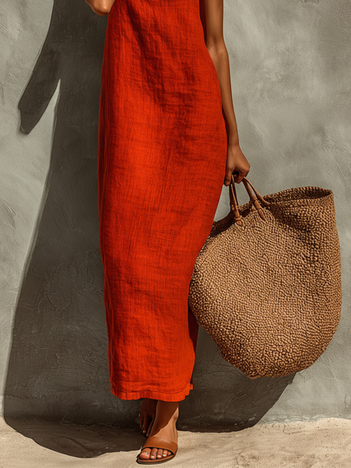 Close-up of women's square neck spaghetti strap maxi dress. Elegant and comfortable summer fashion.