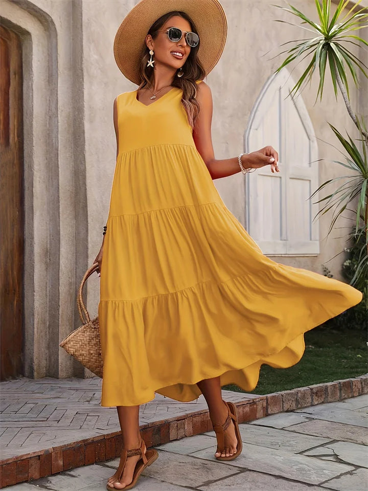 Casual women's sleeveless V-neck tiered maxi summer dress, a flowing and stylish choice for summer.