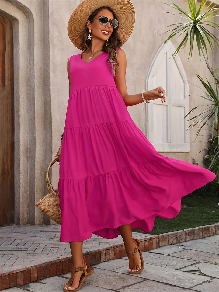 Graceful flowing women's sleeveless tiered maxi summer dress, comfortable and stylish for warm weather.
