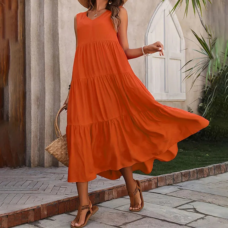 Versatile women's sleeveless tiered maxi summer dress, great for beach, vacation, or casual elegance.