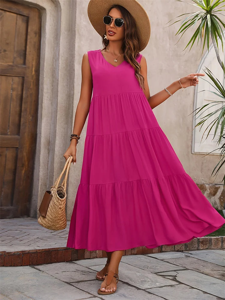 Effortless women's sleeveless tiered maxi summer dress, perfect as a beach cover-up or vacation outfit.