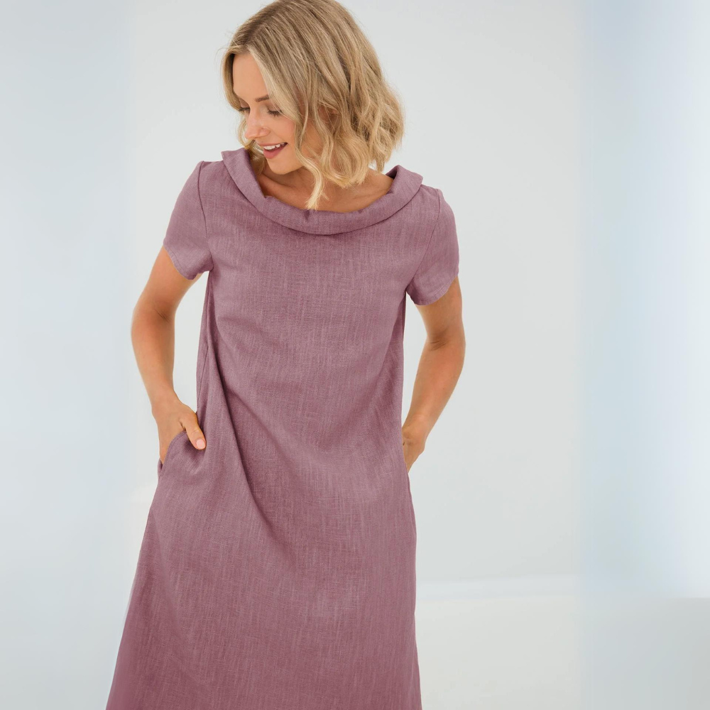 Women's flowy linen pocket dress, perfect as a versatile summer vacation sundress.