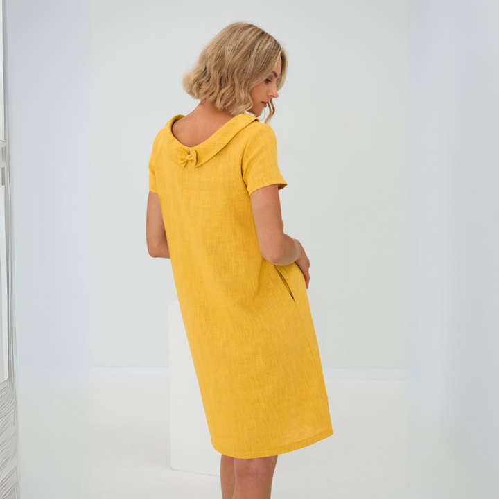 Effortless short sleeve linen summer dress with practical pockets for women's comfort.
