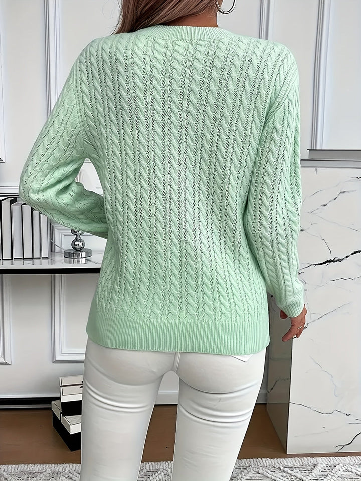 Classic women's cable knit sweater with a round neck and long sleeves, perfect for stylish spring and autumn outfits.