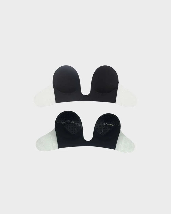 Invisible strapless backless adhesive bra for a seamless look under special occasion outfits. Deep plunge.