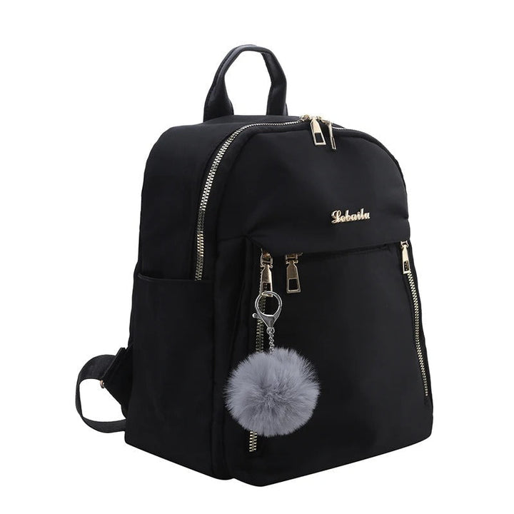 Model wearing a women's fashion PU leather travel backpack, perfect for daily commutes, work or school.