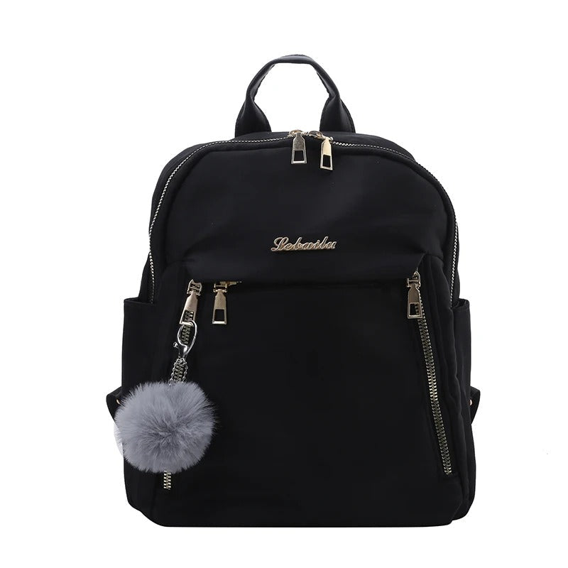 Spacious interior of a women's organized PU leather travel backpack, showing multiple compartments.