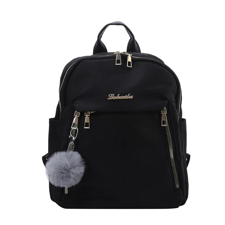 Spacious interior of a women's organized PU leather travel backpack, showing multiple compartments.