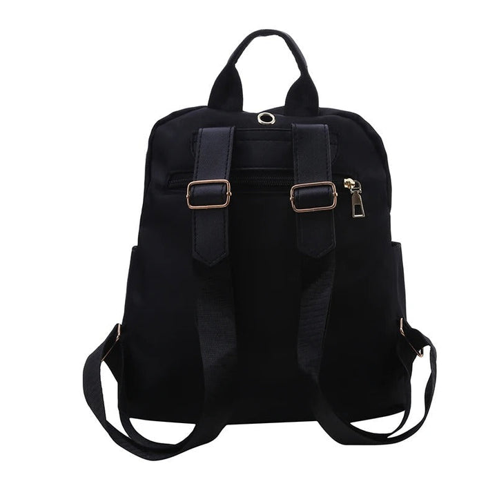 Close-up of premium black PU leather texture on a women's stylish travel and daily use backpack.
