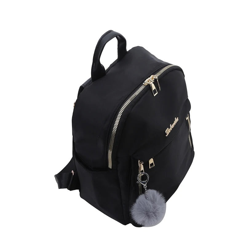 Front view of a chic women's PU leather travel backpack with gold-tone zippers, ideal for school or work.
