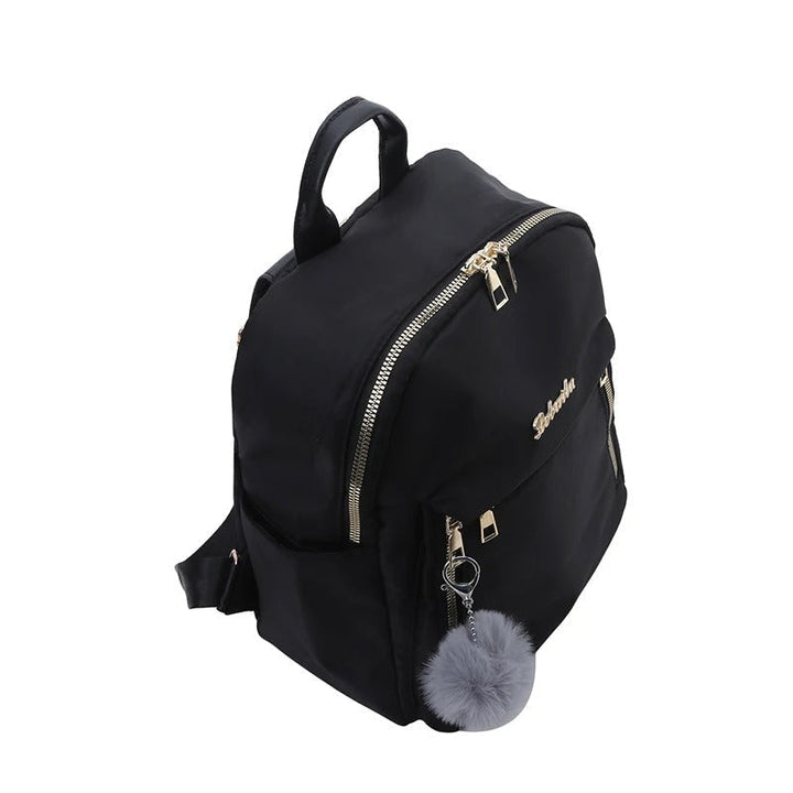 Front view of a chic women's PU leather travel backpack with gold-tone zippers, ideal for school or work.