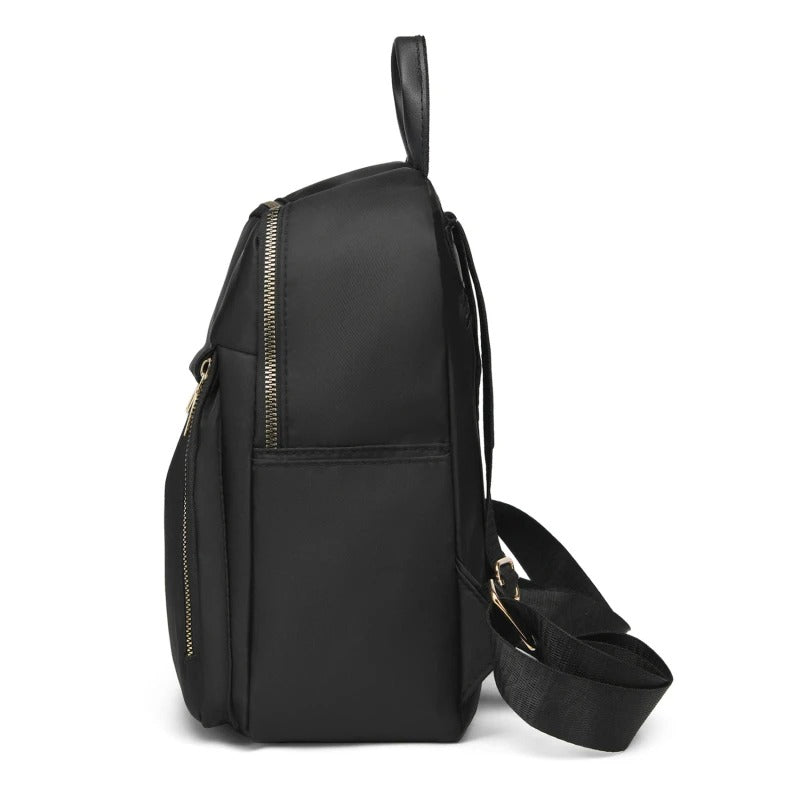 Side profile of a durable women's PU leather travel backpack, suitable for school, work, and daily errands.