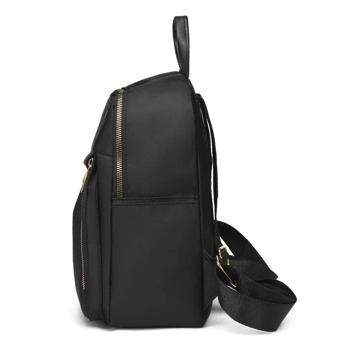 Side profile of a durable women's PU leather travel backpack, suitable for school, work, and daily errands.