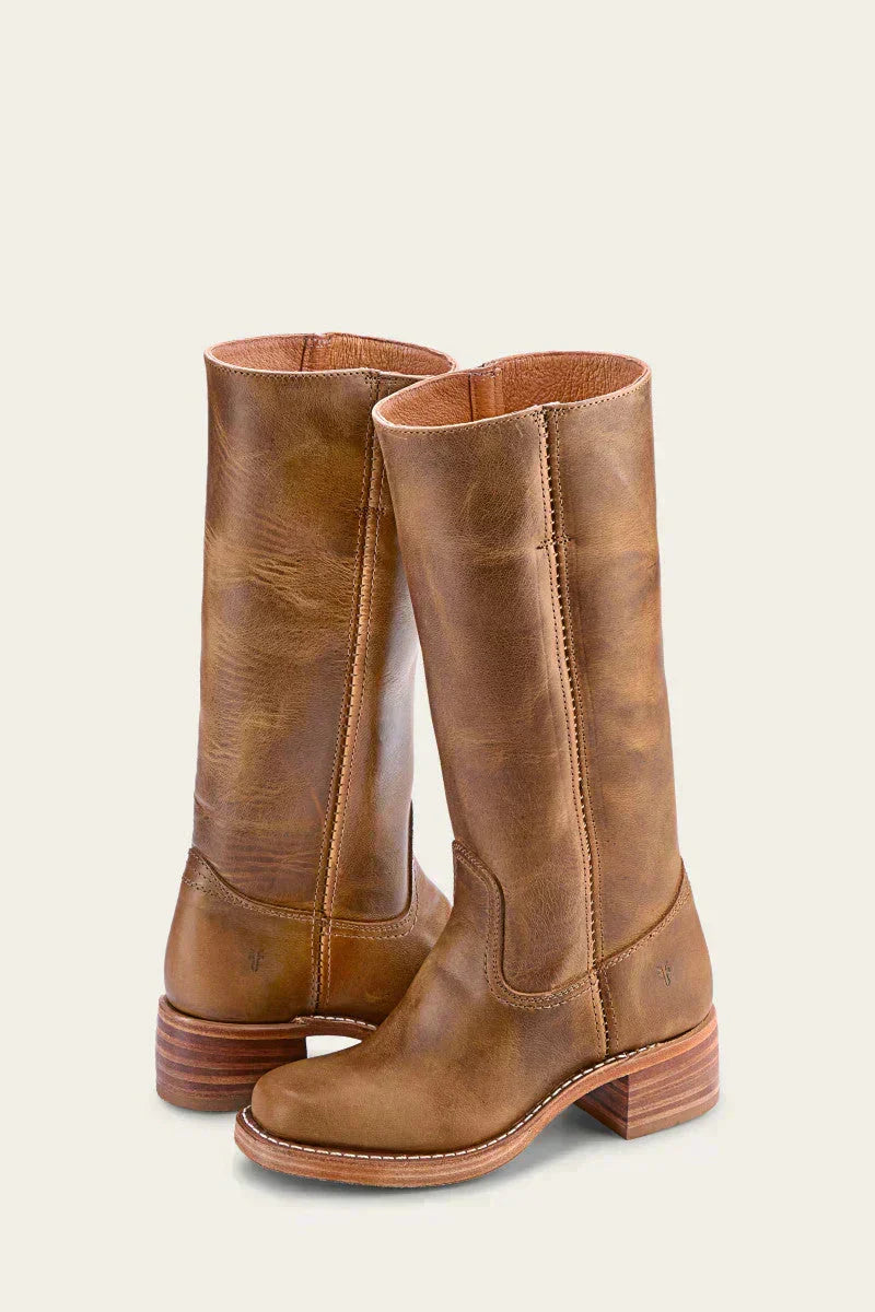 Elegant women's mid-calf block heel boots with a closed toe, ideal for winter outfits.
