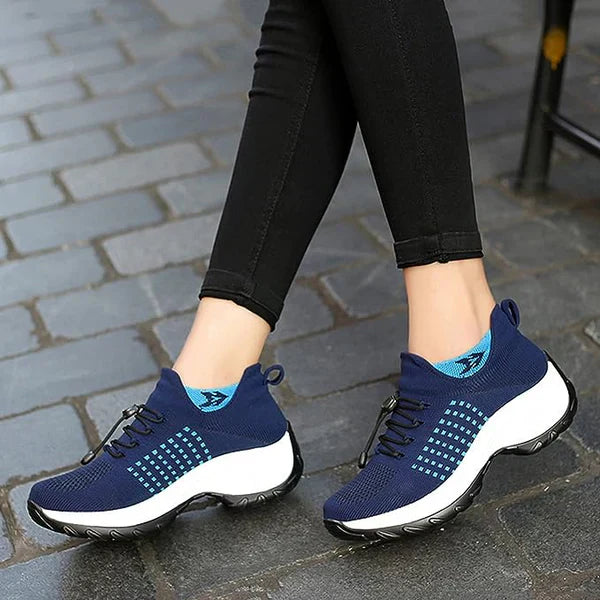 Woman walking in comfortable orthotic shoes, providing plantar fasciitis relief & arch support for active wear.