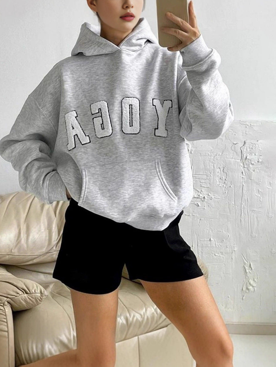 Cozy women's printed yoga hoodie. Ideal activewear pullover for workouts, lounging, or everyday comfort.