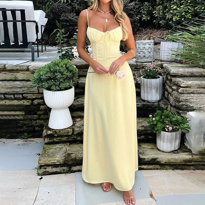 Elegant white sleeveless maxi dress for women, featuring a comfortable ruched bodice; ideal for summer holidays.