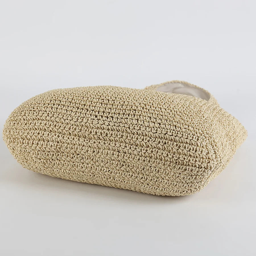 Lightweight women's straw shoulder bag, a spacious beach tote for your summer essentials. Great for vacations.
