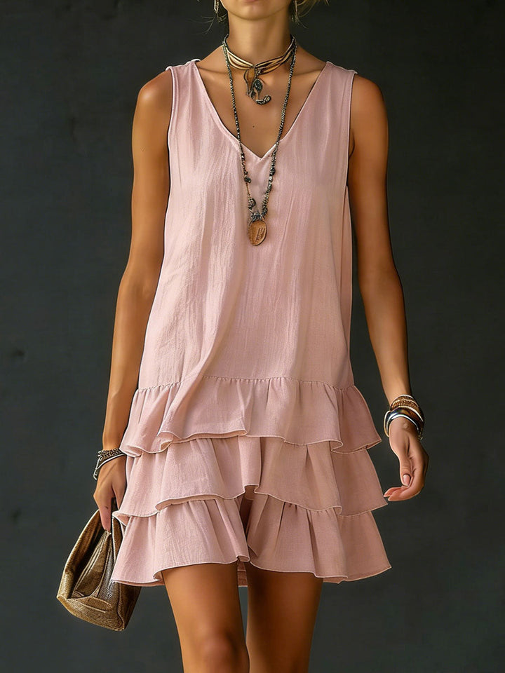 Sleeveless V-neck tiered mini dress for women, featuring delicate ruffles and a comfortable fit.