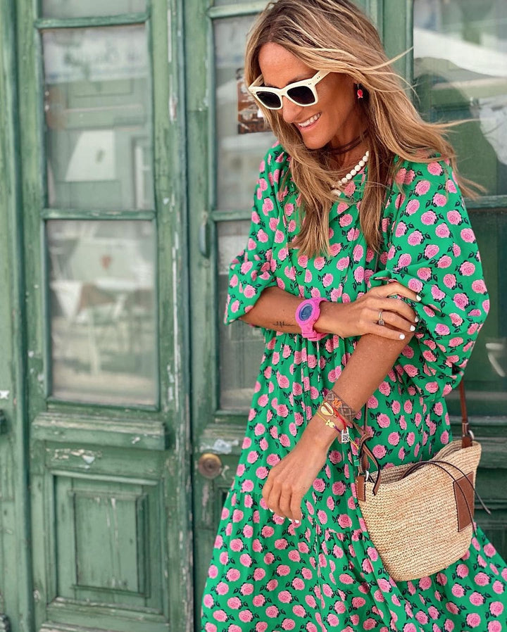 Elegant women's tiered maxi dress with stylish balloon sleeves & a vibrant floral design. Perfect for spring/summer.