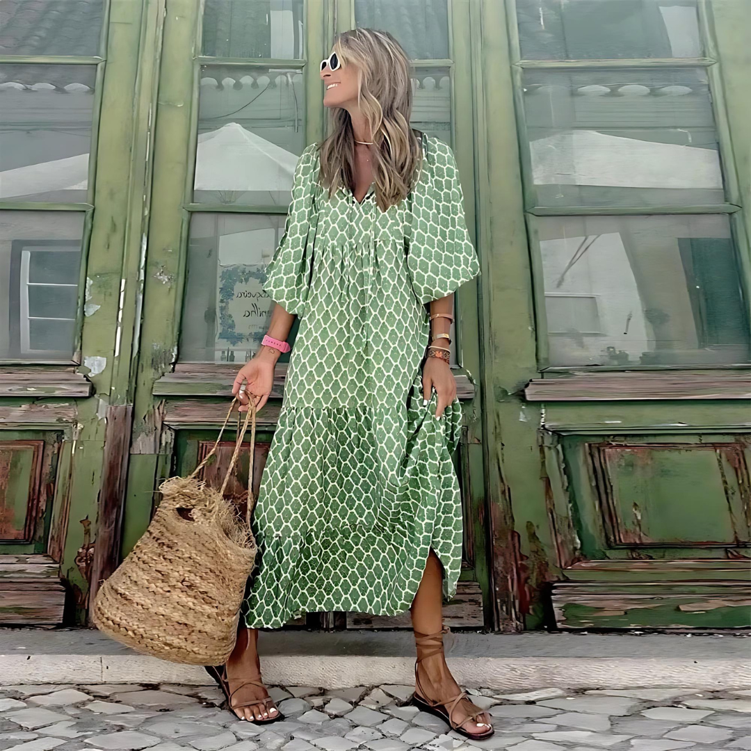 Chic women's tiered maxi dress for spring fashion. Features a delightful floral pattern & comfortable balloon sleeves.