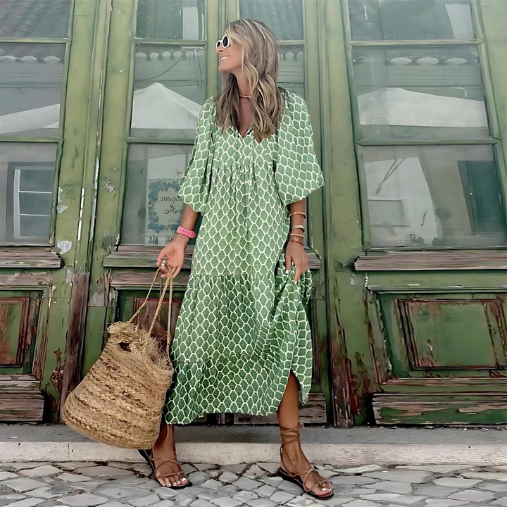 Chic women's tiered maxi dress for spring fashion. Features a delightful floral pattern & comfortable balloon sleeves.