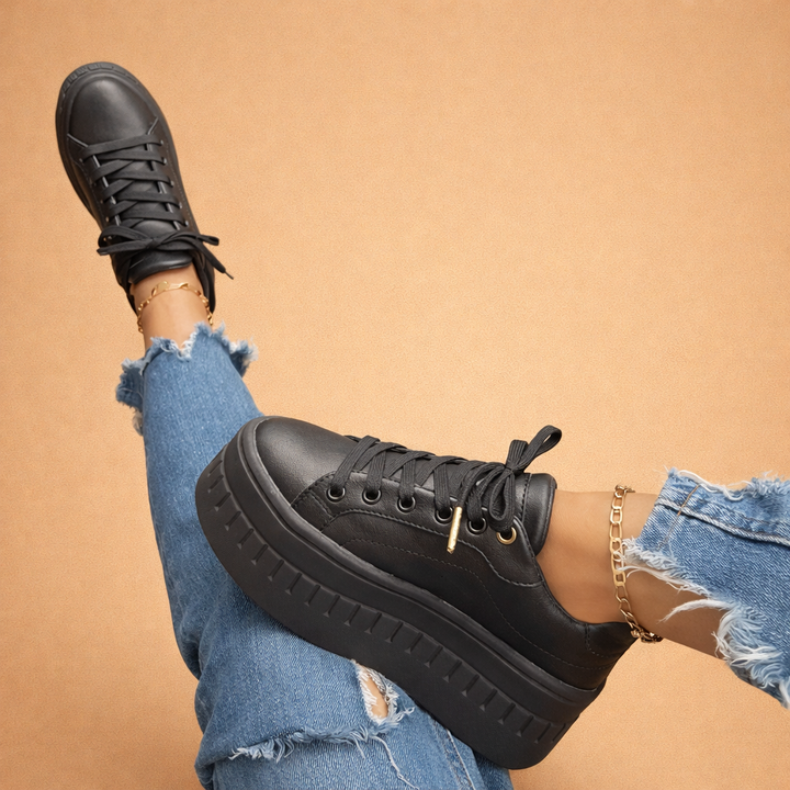 Black women's platform sneakers with a thick sole & comfortable fit, ideal for urban fashion & spring summer looks.