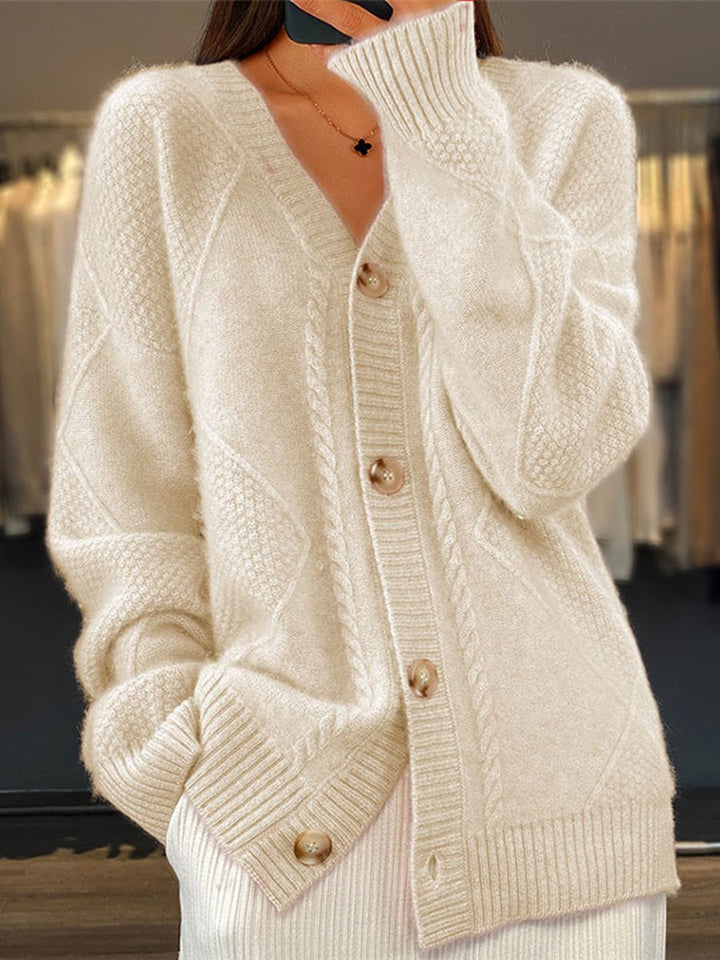 Women's V-neck cable knit cardigan sweater with button front. Cozy long sleeve knit for fall & winter fashion.