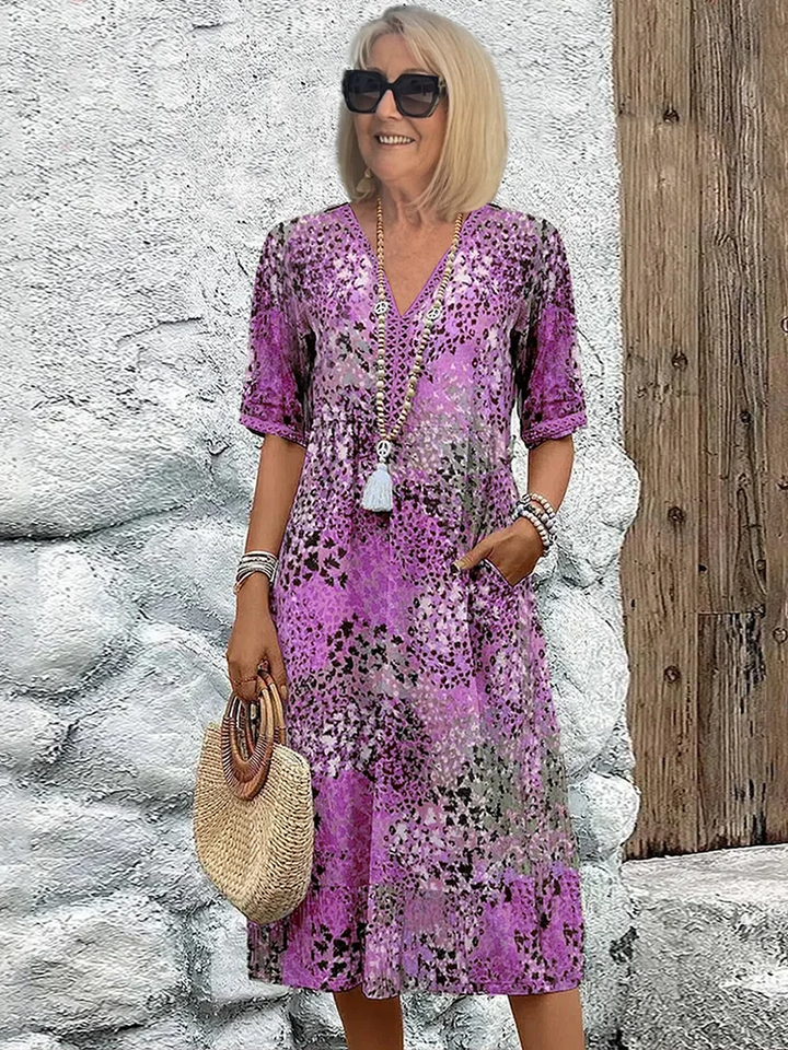Comfortable women's flowing midi dress with a vibrant pattern, essential for chic summer style.