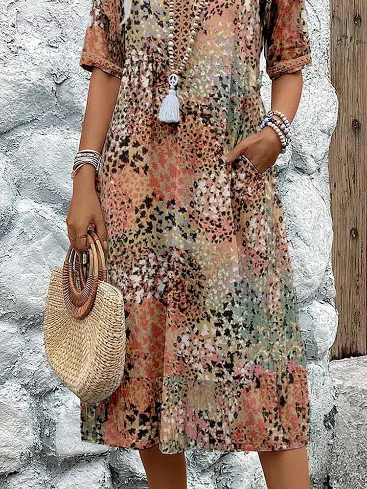 Stylish women's vibrant pattern midi dress, flowing silhouette, elegant design, flattering fit, summer occasion.